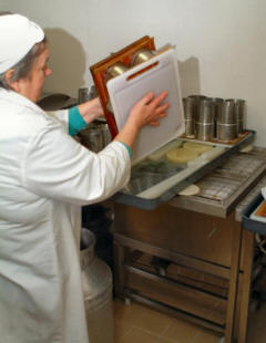 Turning the cheese at West Highland Dairym Achmore, Stromeferry